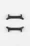 Two black smartwatch strap adapters with a matte finish, shown from different angles on a light grey background.