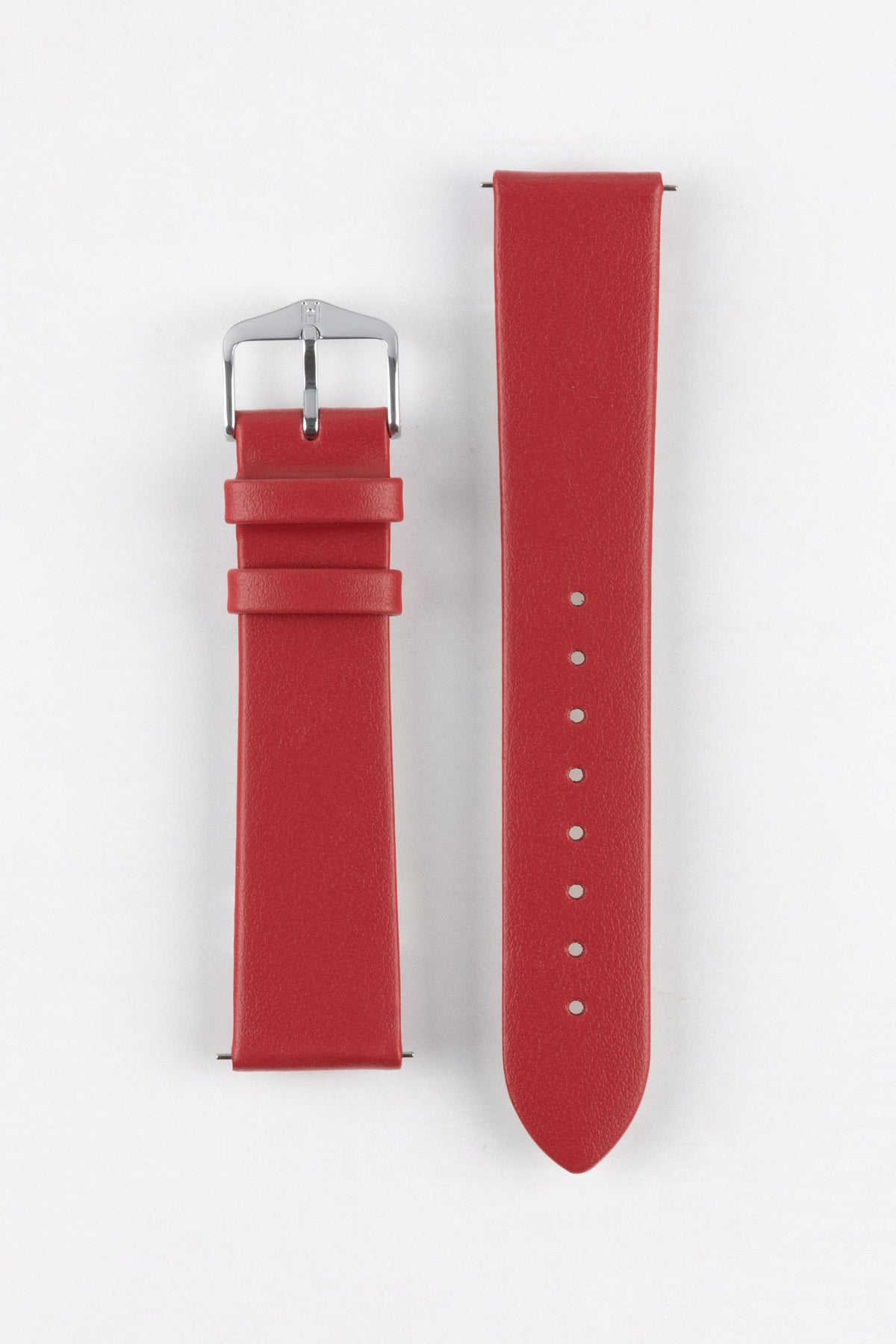 Red leather watch strap with a smooth matte finish and polished stainless steel pin buckle, displayed flat against a clean white background. The image showcases the strap's tapered profile, matching red keepers, integrated quick-release spring bars, adjustable sizing holes, and minimalist design, highlighting its vibrant colour and versatile everyday styling.