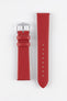 Red leather watch strap with a smooth matte finish and polished stainless steel pin buckle, displayed flat against a clean white background. The image showcases the strap's tapered profile, matching red keepers, integrated quick-release spring bars, adjustable sizing holes, and minimalist design, highlighting its vibrant colour and versatile everyday styling.