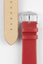 Close-up of a red leather watch strap displayed with the underside and buckle end visible, showcasing the smooth leather surface, cream leather lining, matching red edge finishing, polished stainless steel pin buckle, and integrated keepers. The image highlights the strap's premium construction, soft leather texture, and classic versatile styling against a clean white background.