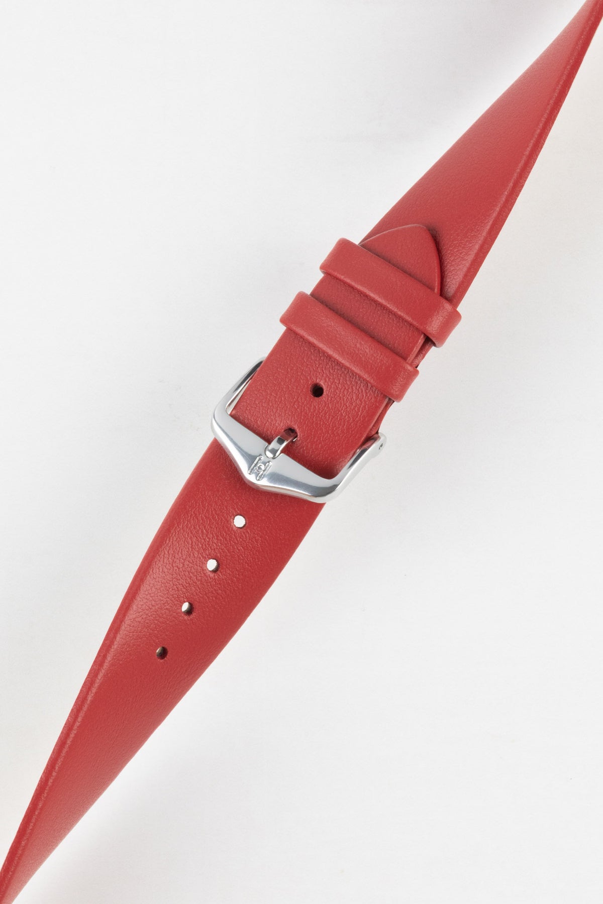 Red leather watch strap with a smooth matte finish and polished stainless steel pin buckle, displayed fastened against a clean white background. The image highlights the strap's tapered profile, matching red keepers, adjustable sizing holes, and premium leather construction, showcasing its vibrant colour and minimalist everyday style.