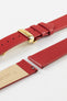 Close-up of a red leather watch strap displayed partially disassembled to showcase its integrated quick-release spring bars, cream leather lining, smooth leather surface, matching red edge finishing, and gold-tone deployant clasp. The image highlights the strap’s premium craftsmanship, easy strap-change system, and elegant dress-watch styling against a clean white background.