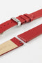 Close-up of a red leather watch strap displayed partially disassembled to showcase its integrated quick-release spring bars, cream leather lining, smooth leather surface, matching red edge finishing, and polished stainless steel buckle. The image highlights the strap’s easy-change mechanism, premium craftsmanship, and clean contemporary styling against a white background.