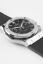 Close-up of a Hublot Classic Fusion chronograph with a black dial and rubber strap, highlighting the brushed bezel, subdials, and polished case details against a clean white background.