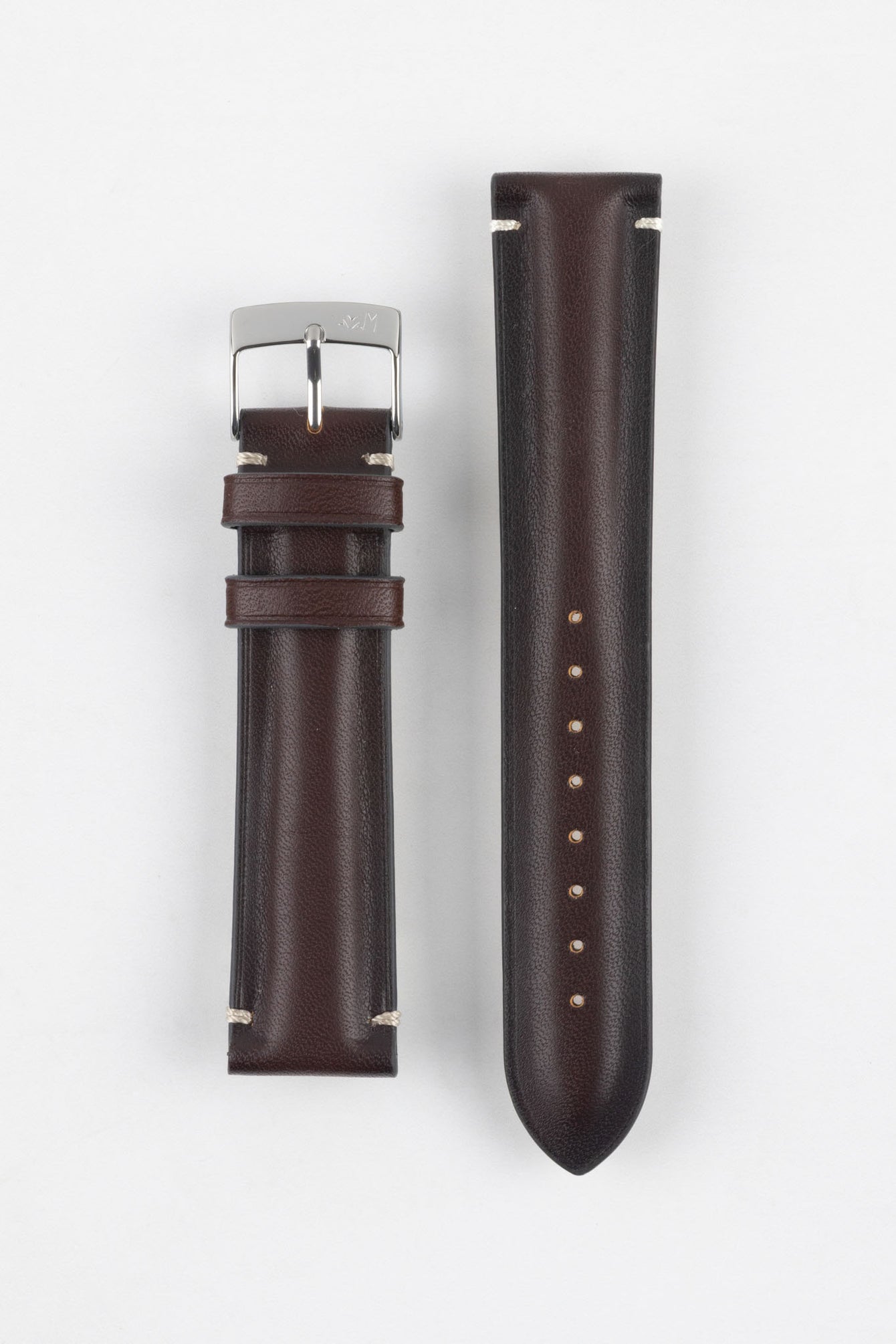 Two burgundy leather watch strap pieces displayed vertically on a light grey background. One strap section features a polished silver tang buckle with an engraved logo and two leather keepers, while the other shows a tapered end with a row of evenly spaced adjustment holes. The leather has a smooth, slightly pebbled texture with subtle light stitching near the lugs, highlighting its refined finish.