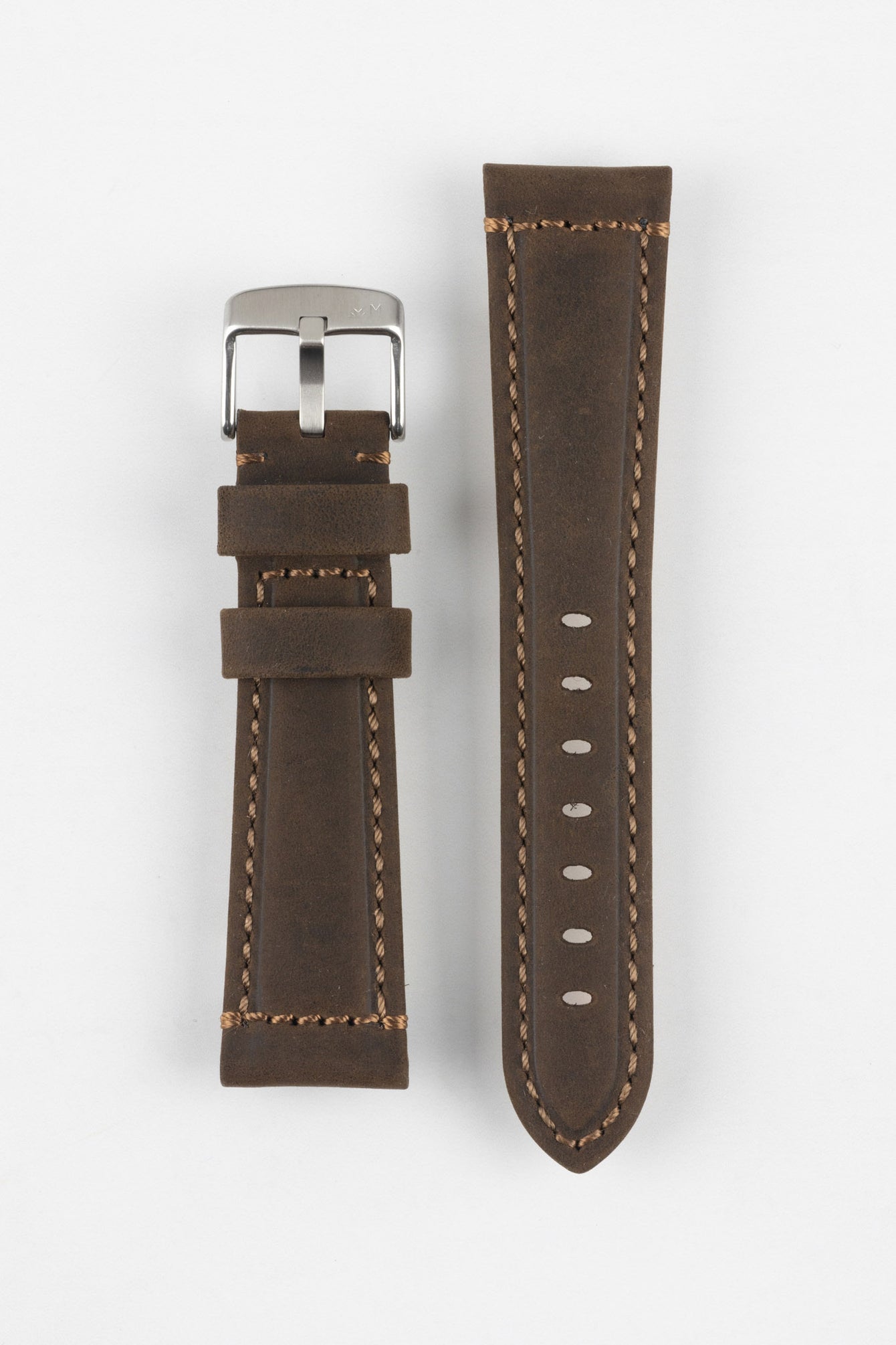 Blue-grey leather watch strap with light blue stitching, shown in angled close-up with a brushed silver buckle, adjustment holes, and tan suede underside sections.