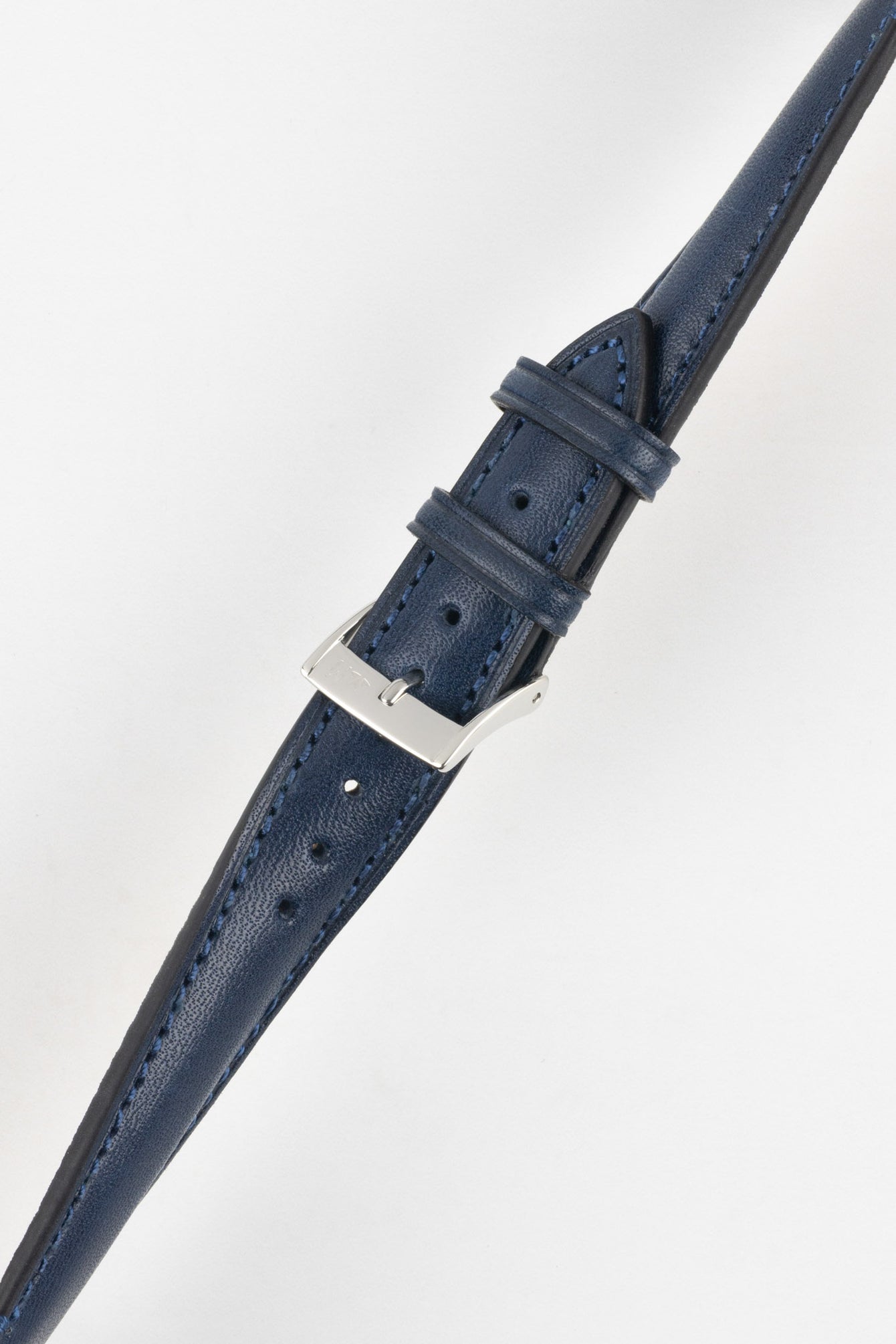 Blue leather watch strap with matching stitching, shown in angled close-up with a silver buckle and adjustment holes.