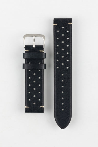 
A high-angle studio shot of a black Morellato Brahms watch strap with white stitching and a stainless steel buckle, laid flat against a white background. The strap features a rally-style design with two rows of perforations.