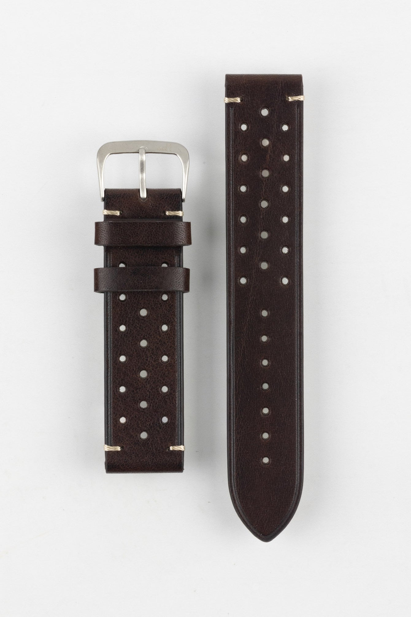 A high-angle studio shot of a dark brown Morellato Brahms watch strap with beige stitching and a stainless steel buckle, laid flat against a white background. The strap features a rally-style design with two rows of perforations.