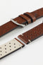 A detailed, high-angle shot of a medium brown, 'gold' Morellato Brahms watch strap, unbuckled and laid flat against a white background. The image highlights the perforated design and the beige stitching at the short end, showing the light-coloured lining of the strap.