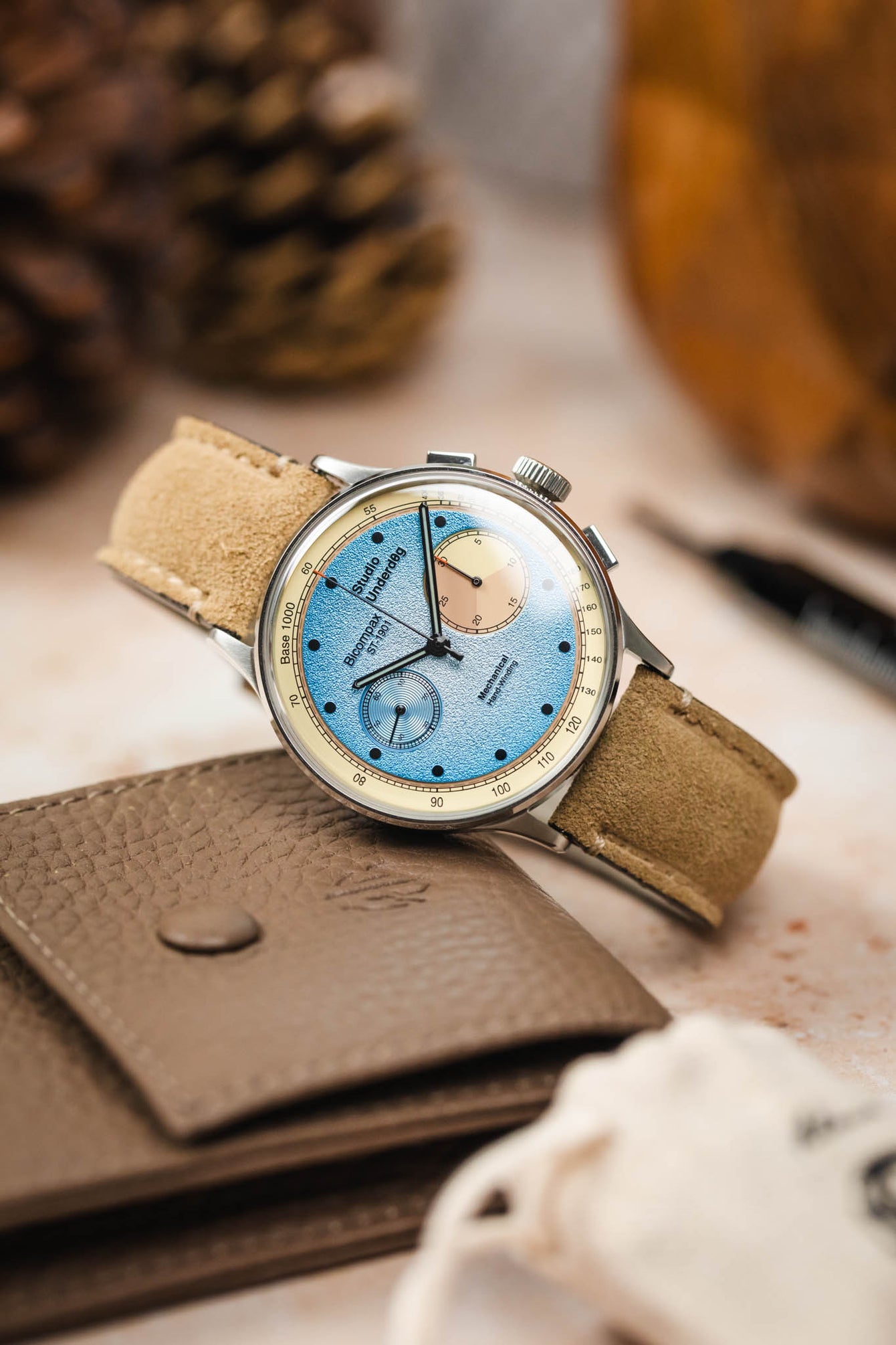 Morellato SCHUMANN beige suede watch strap with Studio Underd0g Bicompax ST-1901 watch on table. Find your next watch band.