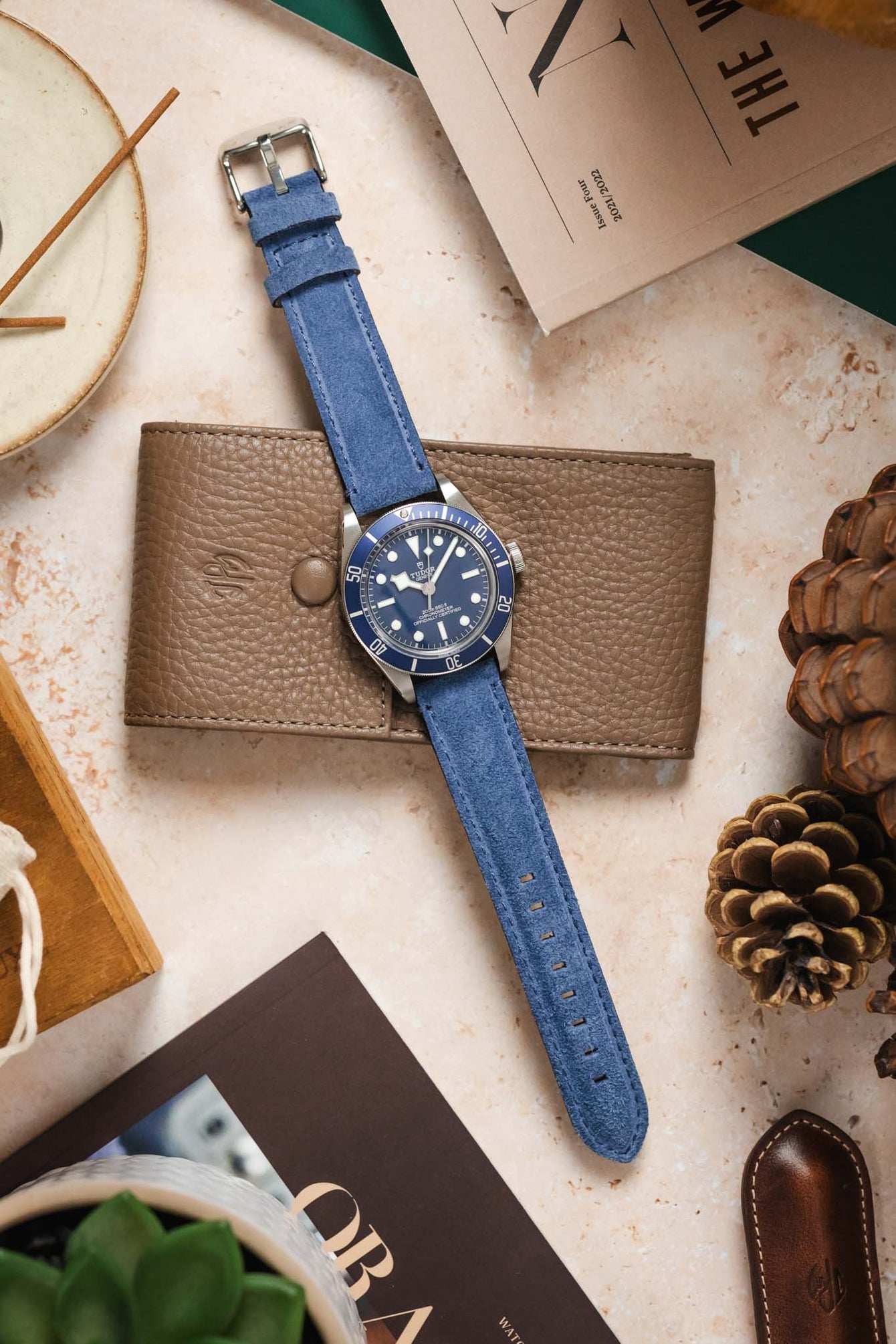 Morellato SCHUMANN blue suede watch strap with a Tudor Black Bay 58 watch on a textured surface. Shop quality watch straps.