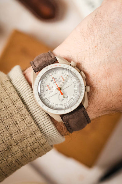 Morellato SCHUMANN brown suede watch strap on wrist with an Omega MoonSwatch watch. Add a touch of elegance to your watch.