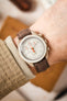 Morellato SCHUMANN brown suede watch strap on wrist with an Omega MoonSwatch watch. Add a touch of elegance to your watch.