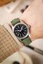 Morellato SCHUMANN green suede watch strap on wrist with a Hamilton Khaki Field watch. Elevate your everyday style with our watch bands.
