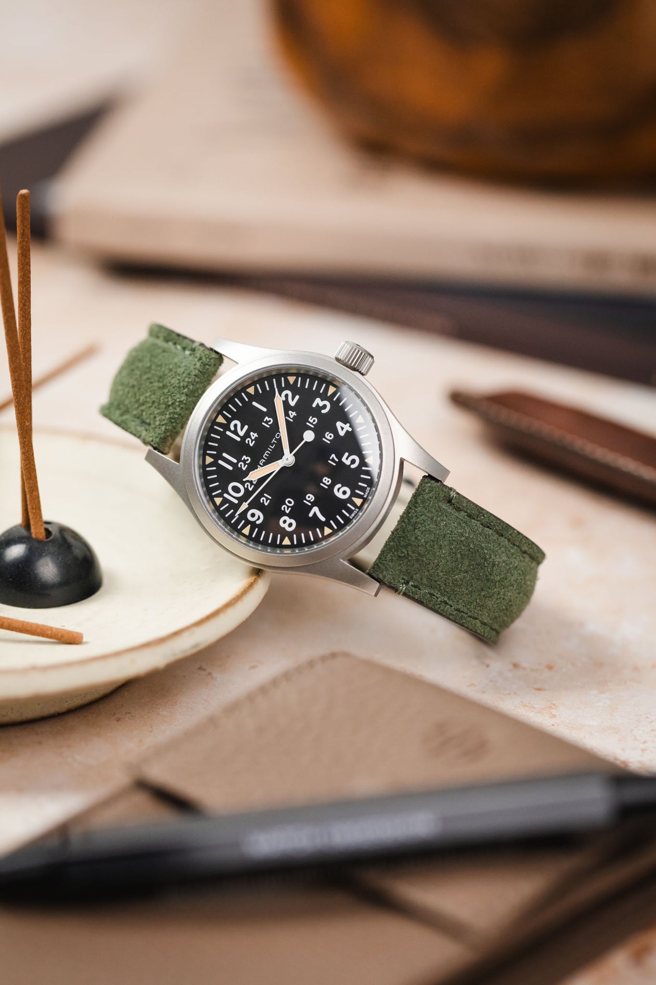 Morellato SCHUMANN green suede watch strap with a classic Hamilton Khaki Field watch. Perfect for adventurers and watch enthusiasts.