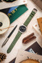 Overhead shot of Morellato SCHUMANN green suede watch strap with Hamilton Khaki Field watch and desk accessories. Shop stylish watch straps.