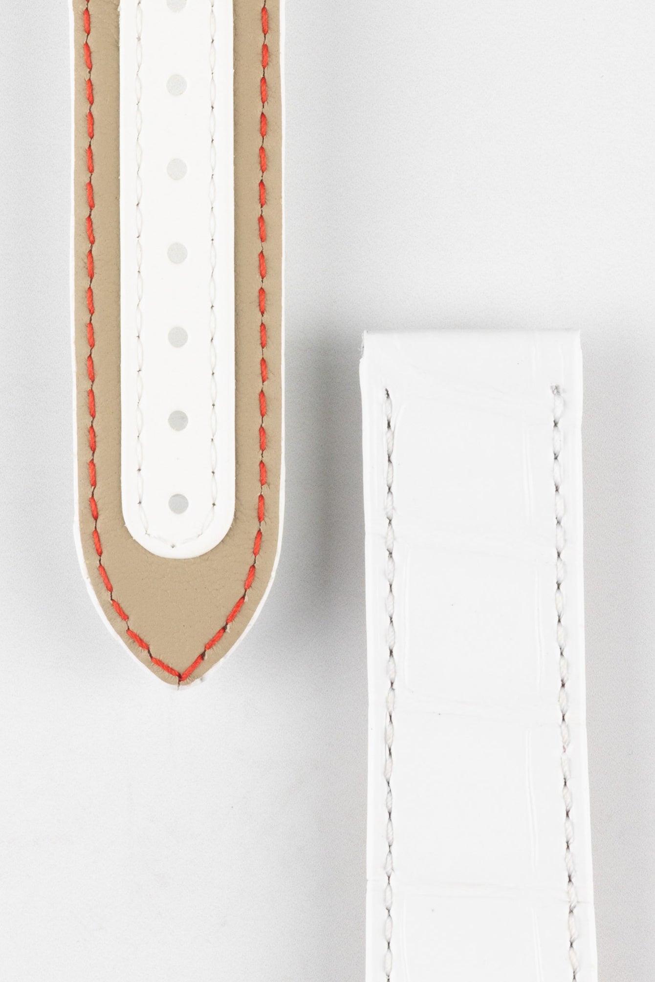 Close up of topside and lining of Omega Alligator Watch Strap, showing the tang hole patch, soft lining and deployment end.