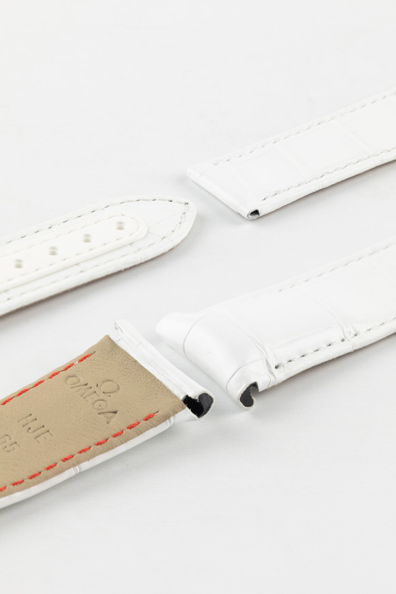 Photo Showing ends of Omega Watch Strap, image shows deployment end and tang with the springbar holes. Product code CUZ004401