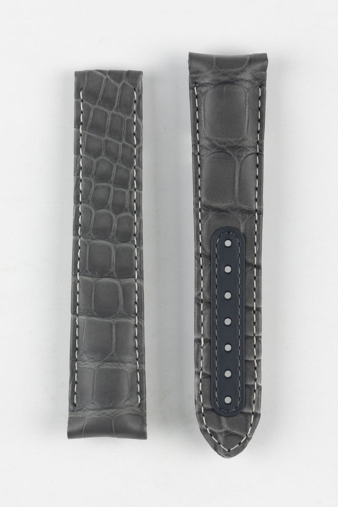 Image Showing Topside of Omega CUZ004450 Genuine Alligator Skin Delployment Watch Strap in Grey, the strap is designed to fit the Grey Side of the Moon Watch. The Strap has a patch on the tang holes for durability and strength.