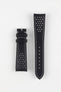 Product shot of a black leather watch strap displayed against a white background, showing both sections separately: one with two keepers and white contrast stitching near the lug end, and the other with a pointed tip, multiple adjustment holes, and perforated detailing, highlighting the smooth finish and sporty design.