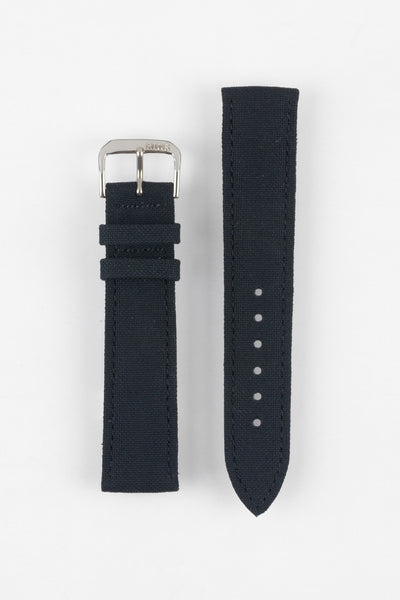 Front view of a dark navy fabric watch strap displayed in two separate pieces on a light gray background. One piece features a polished silver-tone RIOS-branded buckle and matching fabric keepers, while the other shows six adjustment holes and a pointed tip. The woven texture and stitched edges are clearly visible throughout the strap.