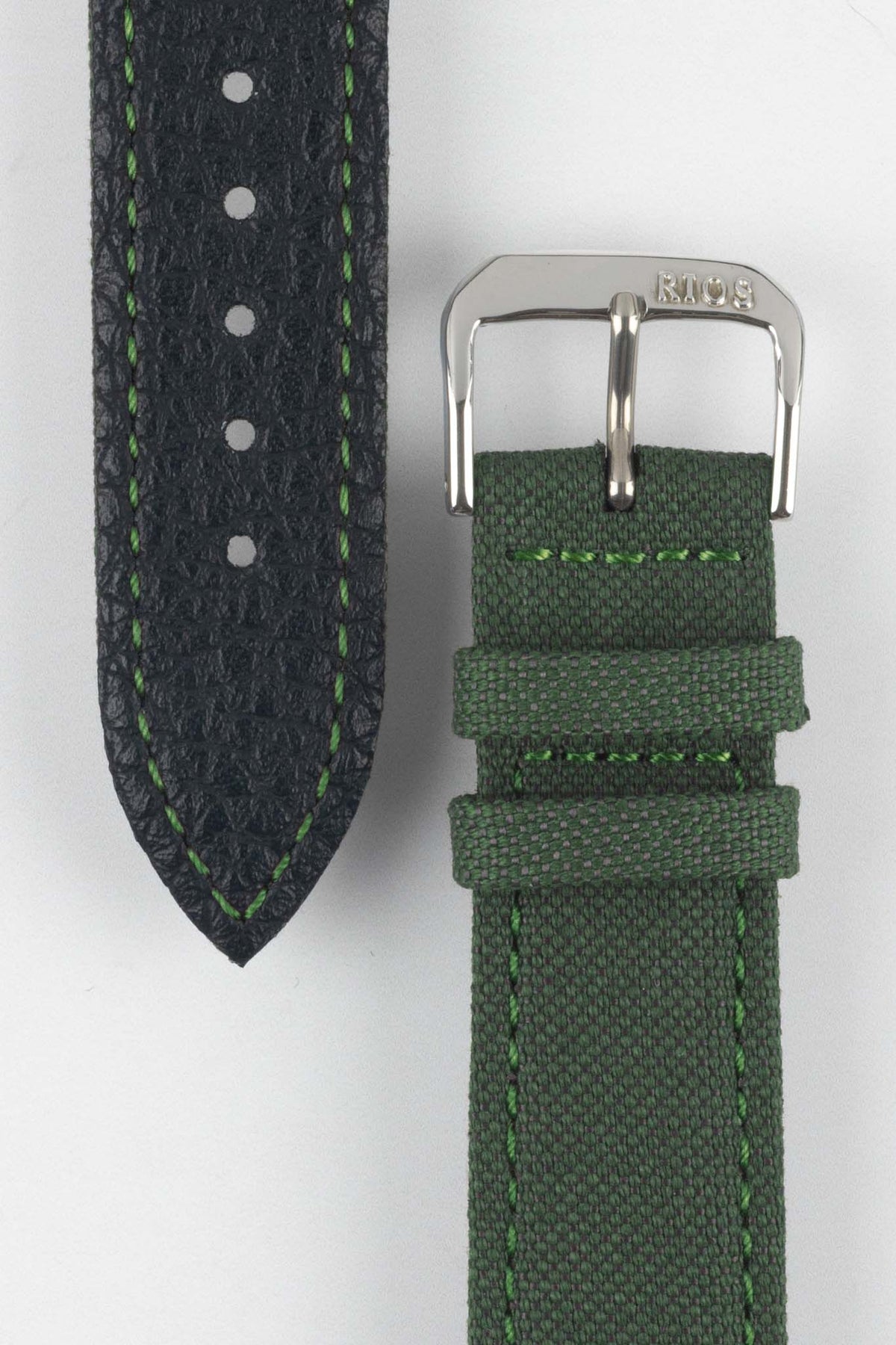 Olive green canvas watch strap with a black leather lining, green contrast stitching, and a polished RIOS1931 stainless steel buckle, displayed on a white background.