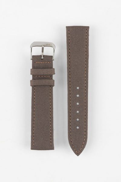 Mocha brown fabric watch strap with a silver-tone RIOS buckle, shown in two pieces with stitched edges, adjustment holes, and a pointed tip.