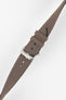 Angled view of a mocha brown fabric watch strap with a silver-tone RIOS buckle, adjustment holes, and matching stitched edges.