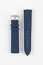 Front view of an ocean blue fabric watch strap displayed in two separate pieces on a light gray background. The strap features a woven textile texture, stitched edges, a polished silver-tone RIOS-branded buckle, and two matching fabric keepers. The adjustment section shows six sizing holes and a pointed tip, highlighting the strap’s clean, durable construction.