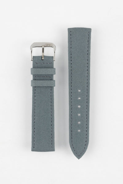 Stone grey fabric watch strap with a silver-tone RIOS buckle, shown in two pieces with stitched edges, adjustment holes, and a pointed tip.