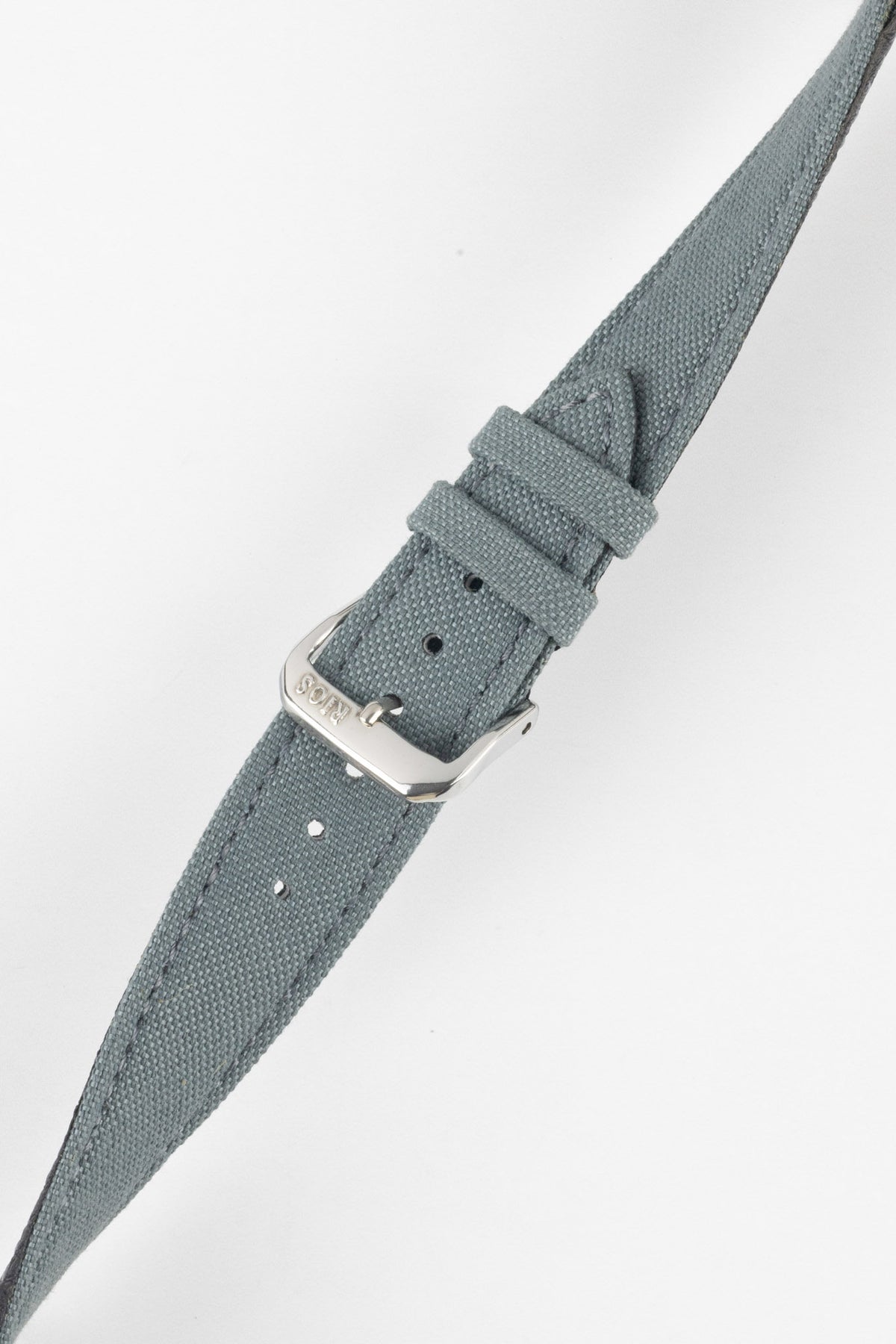 Angled view of a stone grey fabric watch strap with a silver-tone RIOS buckle, adjustment holes, and matching stitched edges.
