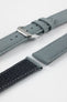 Stone grey fabric watch strap with a silver-tone RIOS buckle, shown with a black leather underside and contrast stitching.