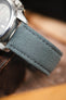 Stone grey canvas watch strap fitted to a Seiko 5 automatic watch, highlighting the woven textile texture and matching grey stitching.