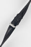 Black perforated leather rally watch strap with black stitching, dual keeper loops, multiple adjustment holes, a polished stainless steel RIOS buckle, and a tapered pointed tip, displayed diagonally on a light grey background to highlight the smooth leather finish, motorsport-inspired perforations, and premium handcrafted construction.