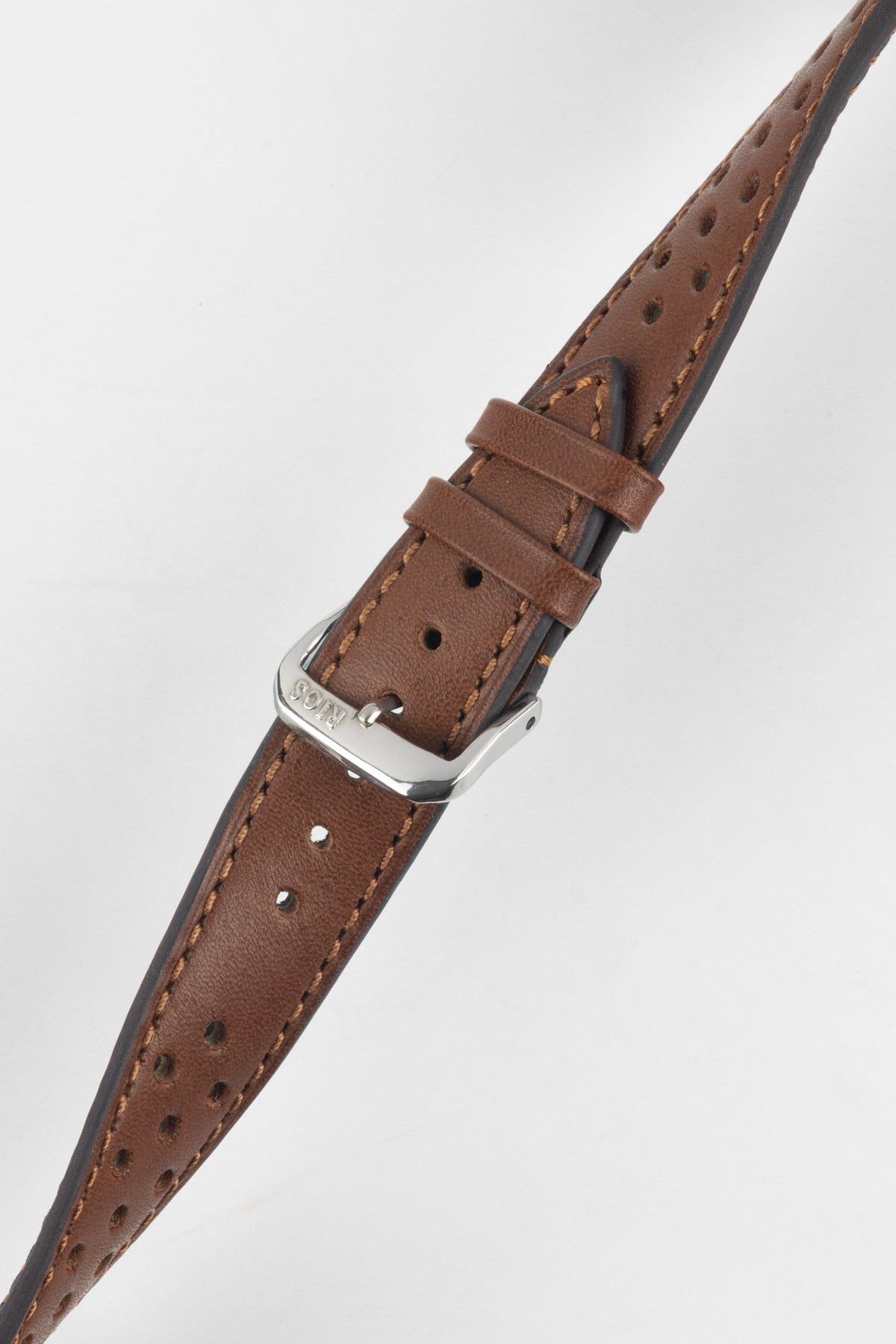 Cognac brown perforated leather rally watch strap with matching brown stitching, dual keeper loops, multiple adjustment holes, a polished stainless steel RIOS buckle, and a tapered pointed tip, displayed diagonally on a light grey background to highlight the rich leather finish, vintage motorsport-inspired design, and premium handcrafted construction.