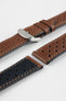 Close-up product shot of brown perforated leather watch strap components with contrast stitching, including one fitted with a polished silver deployment clasp. Additional strap sections, including one with a black underside, are arranged on a plain light background, highlighting the leather texture, perforations, and metal clasp details.