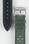 Close-up product shot of a green leather watch strap paired with a black underside strap segment, both featuring contrast green stitching. A polished silver pin buckle is attached to the green strap, and the components are arranged on a plain light background to highlight the leather texture, stitching, and perforation details.