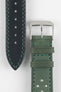 Front and back detail view of a forest green perforated leather rally watch strap featuring a soft nubuck-style finish, turquoise contrast stitching, a black leather lining, dual keeper loops, and a polished stainless steel RIOS buckle, displayed on a light grey background to highlight the vintage motorsport-inspired design, contrasting underside, and premium handcrafted construction.