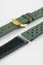 Close-up product shot of green perforated leather watch strap components with contrast green stitching, including one fitted with a polished gold-tone deployment clasp. Additional strap sections, including one with a black underside, are arranged on a plain light background to highlight the soft leather texture, perforations, and metal clasp details.