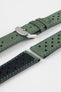 Close-up product shot of green perforated leather watch strap components with contrast green stitching, including one fitted with a polished silver deployment clasp. Additional strap sections, including one with a black underside, are arranged on a plain light background, highlighting the soft suede texture, perforations, stitching, and metal clasp details.