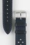 Front and back detail view of an ocean blue perforated leather rally watch strap featuring matching blue contrast stitching, a black leather lining, dual keeper loops, a polished stainless steel RIOS buckle, and a tapered pointed tip. Displayed on a light grey background to highlight the smooth leather finish, motorsport-inspired perforations, contrasting underside, and premium handcrafted construction.