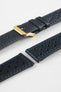 Close-up detail view of an ocean blue perforated leather rally watch strap displayed with one strap section detached, featuring matching blue contrast stitching, multiple motorsport-inspired perforations, dual keeper loops, a polished gold-tone RIOS buckle, quick-release spring bars, and a black leather lining. Displayed on a light grey background to highlight the premium handcrafted construction, contrasting underside, and vintage racing-inspired design.
