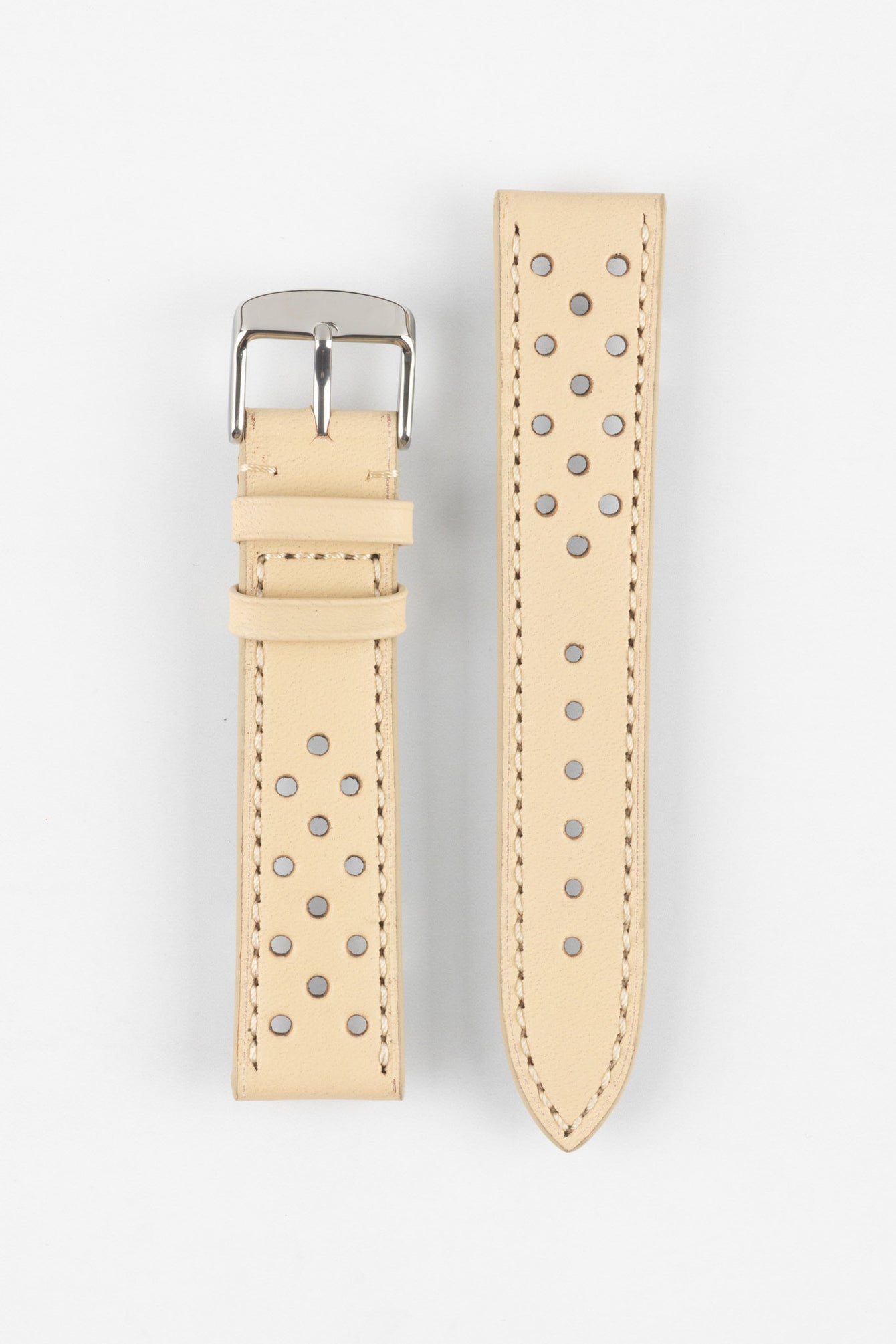 Product shot of a two-piece beige perforated leather watch strap laid flat on a plain light background, featuring contrasting stitching and a polished silver pin buckle on one end.