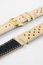 Close-up detail view of a sand-coloured perforated leather rally watch strap displayed with one strap section detached, featuring cream contrast stitching, multiple motorsport-inspired perforations, dual keeper loops, a polished gold-tone RIOS buckle, quick-release spring bars, and a black leather lining. Displayed on a light grey background to highlight the premium handcrafted construction, contrasting underside, and vintage racing-inspired design.
