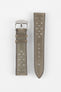 Product shot of a two-piece grey suede perforated leather watch strap laid flat on a plain light background, featuring light contrast stitching and a polished silver pin buckle on one end.