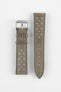 Two-piece stone grey perforated leather rally watch strap with a soft nubuck-style finish, tonal grey stitching, tapered pointed tip, dual keeper loops, multiple motorsport-inspired perforations, quick-release spring bars, and a polished stainless steel RIOS buckle, displayed flat on a light grey background to showcase the vintage racing-inspired design and premium handcrafted construction.
