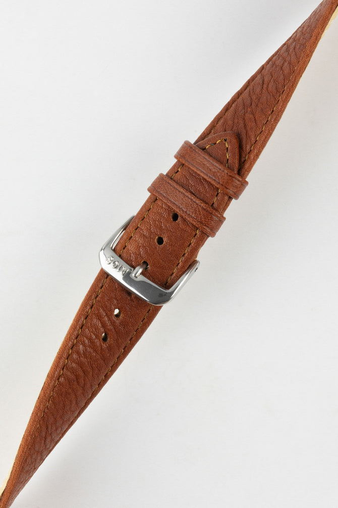 Cognac Organic Leather watch strap twisted to show flexibility