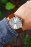 Organic Leather Watch Strap by RIOS1931 fitted to a Seiko Cocktail Time watch with a Blue Dial, on a wrist with a denim shirt cuff