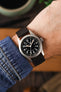 Photo of a wrist wearing a Hamilton Khaki Field Watch with a RIOS1931 Waging watch strap in Brown Mocha